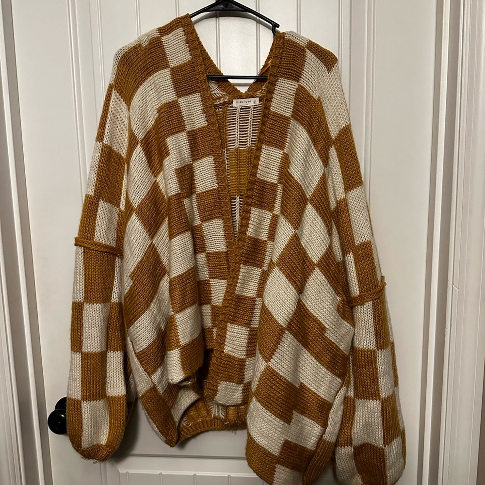 Orange and white checkered sweater